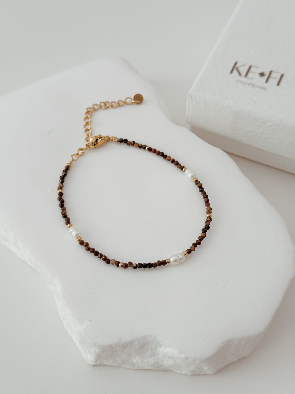 Pulseira Olho de Tigre | pérola  água doce